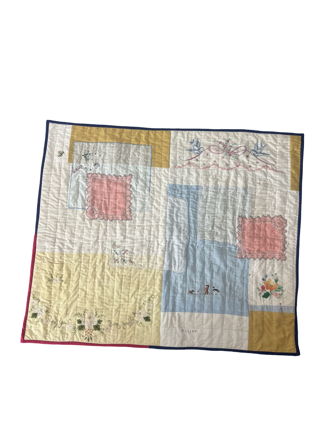 Quilt pieced from vintage embroidered handkerchiefs with bluebirds, flowers, and the name Alison
